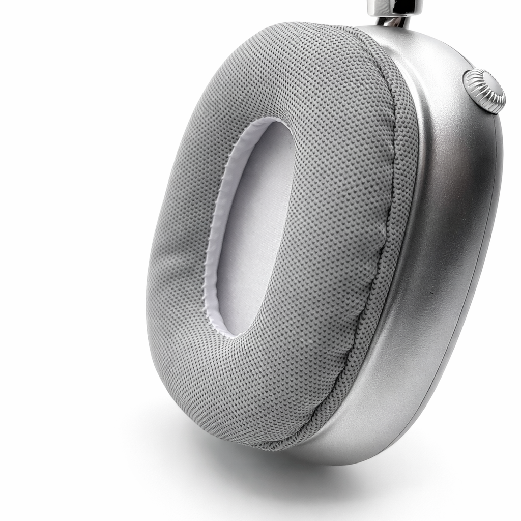 Silver headphones with gray ear cushions on a white background